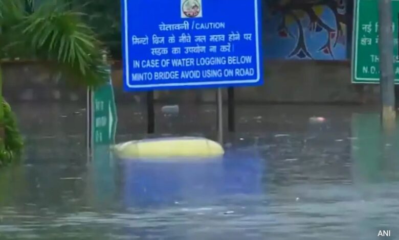 Auto, School Bus Get Stuck In Waterlogged Minto Bridge Underpass, 3 Rescued